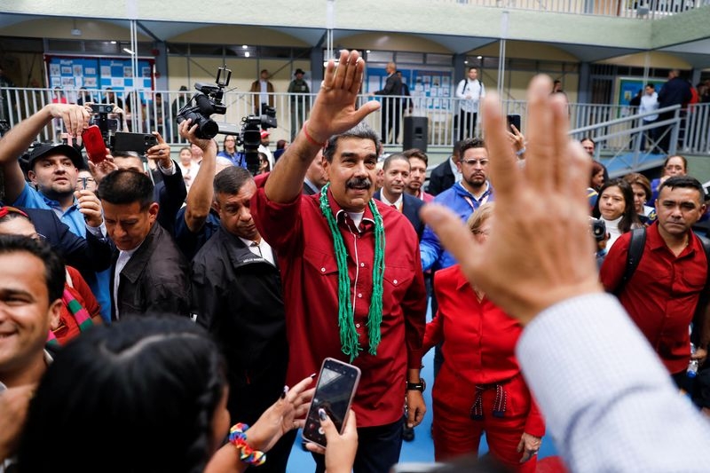 Venezuela ruling party keeps control of legislature amid opposition division