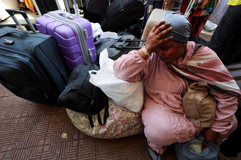 Displaced Sudanese stream home from Egypt after army retakes Khartoum