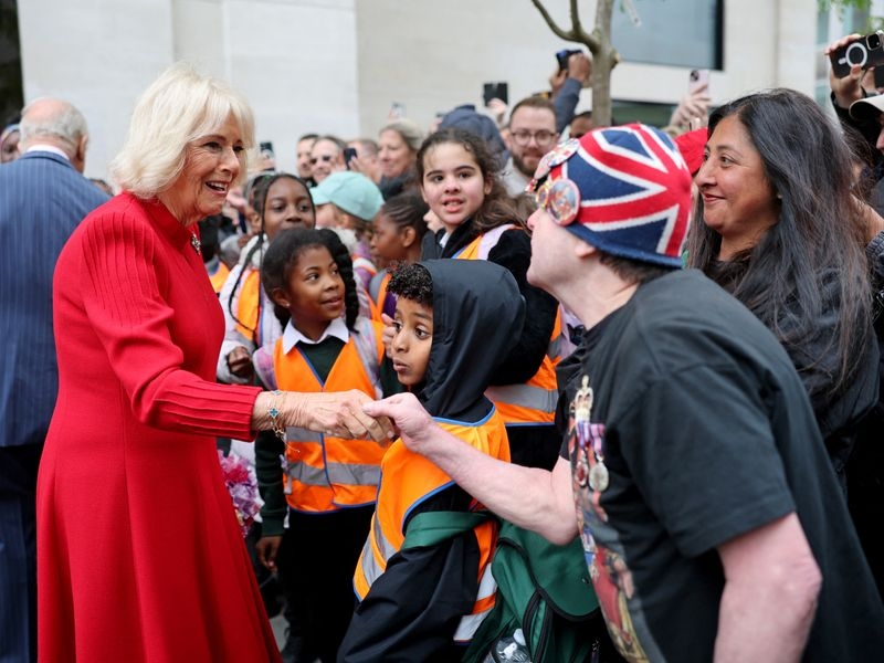 Queen Camilla visits poppy memorial for Victory in Europe Day celebrations