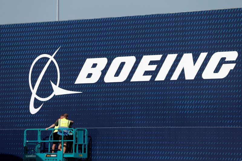 Boeing posts smaller loss as jet deliveries rise