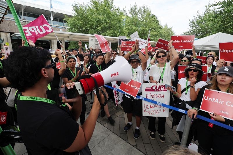 Exclusive-Air Canada and striking union are holding discussions Monday night, source says
