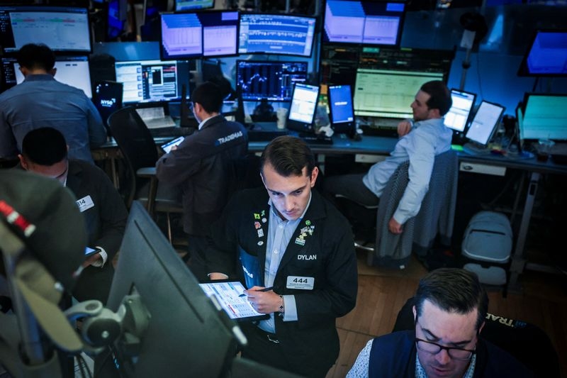 Tariffs hit, Apple rises