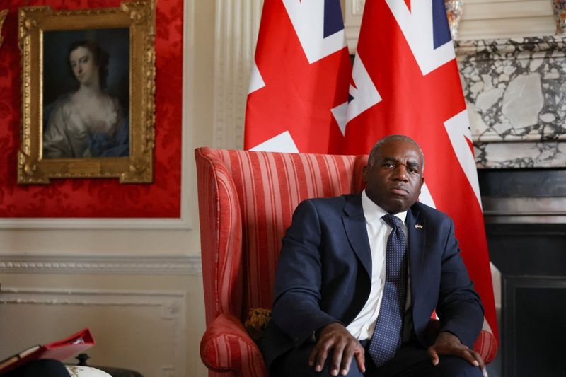 Switzerland is considering joining 'dirty money' task force, UK official says