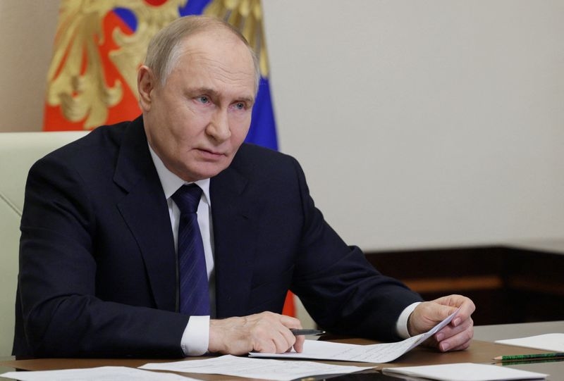 Putin says Russia plans to cut military spending from next year