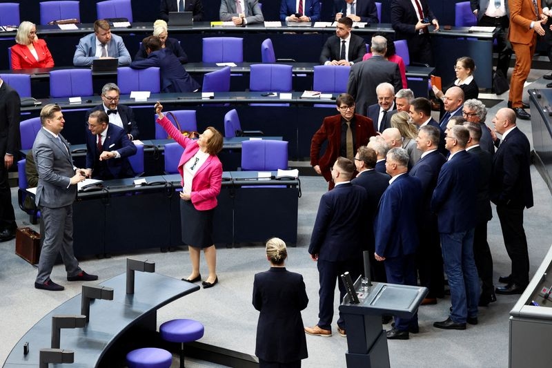 Analysis-Isolated and fearing a ban, Germany's far-right tones down the rhetoric