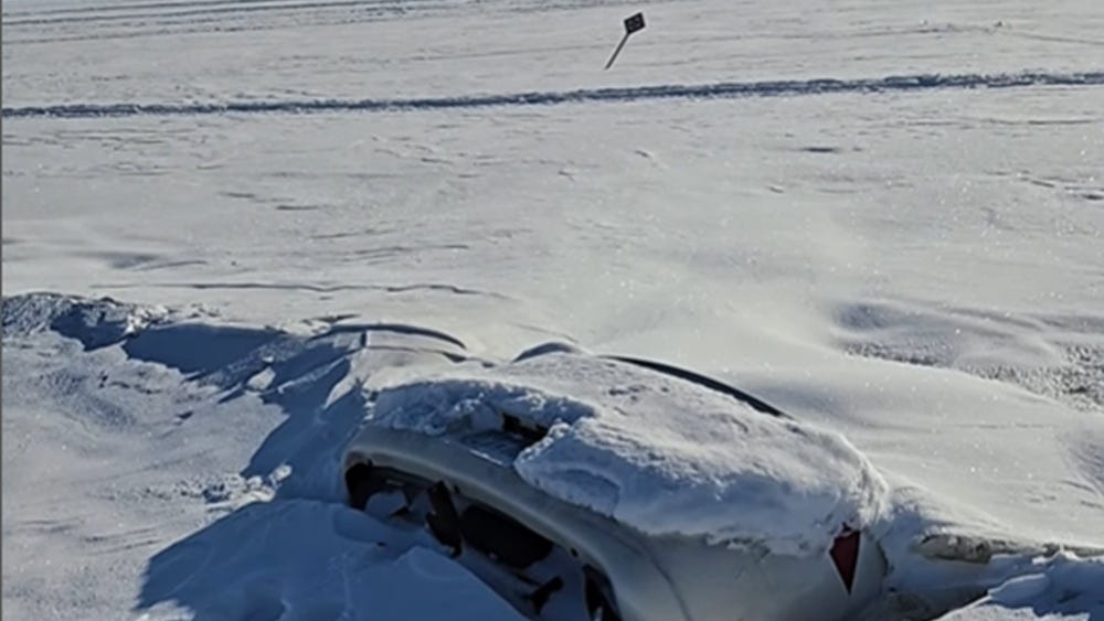 Buick Frozen Tail-Up in Minnesota Lake Becomes Ice Fishing Sensation