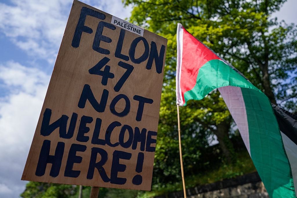 Trump tees off in Scotland as protests, backlash grow