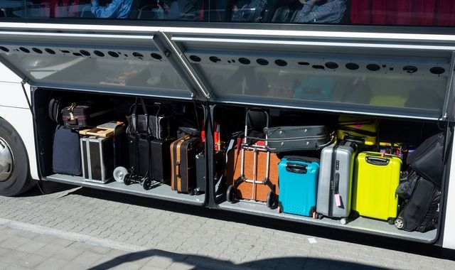 Two-year-old girl found alive in suitcase as woman charged with child neglect