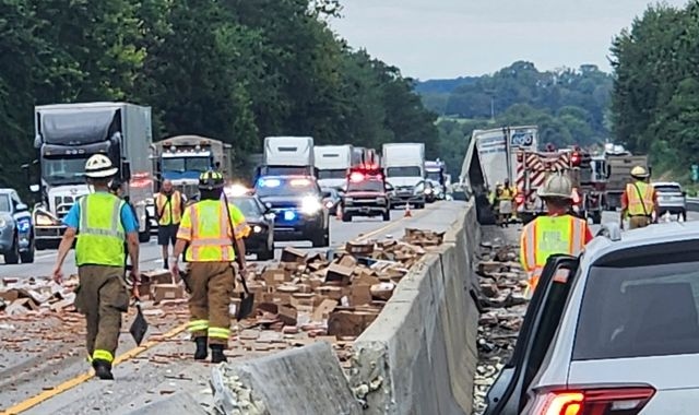 Thousands of hot dogs spill across busy highway