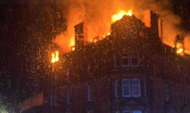Man dies and girl, 8, in hospital after fire at four-storey building in Scotland