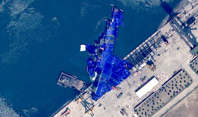North Korea launches investigation into why new warship ended up on its side