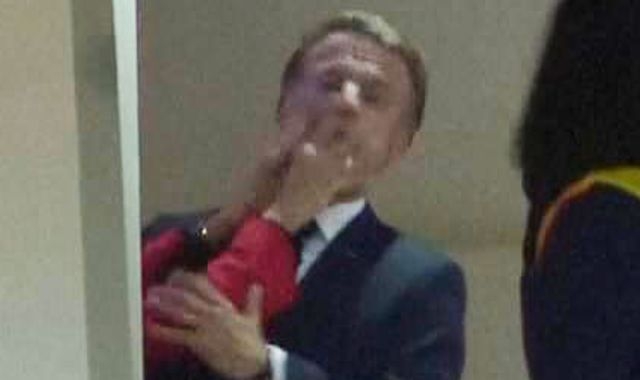 Emmanuel Macron pushed in face by wife - as his office plays down video of 'squabble'