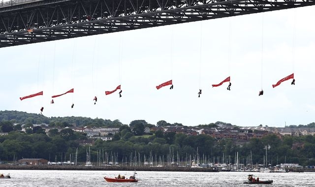 Ten Greenpeace activists arrested after suspending themselves from bridge outside Edinburgh