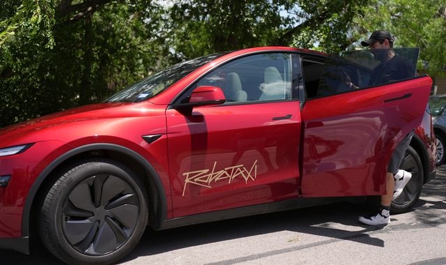 Videos show driverless Tesla 'robotaxis' braking hard without warning - and on wrong side of the road