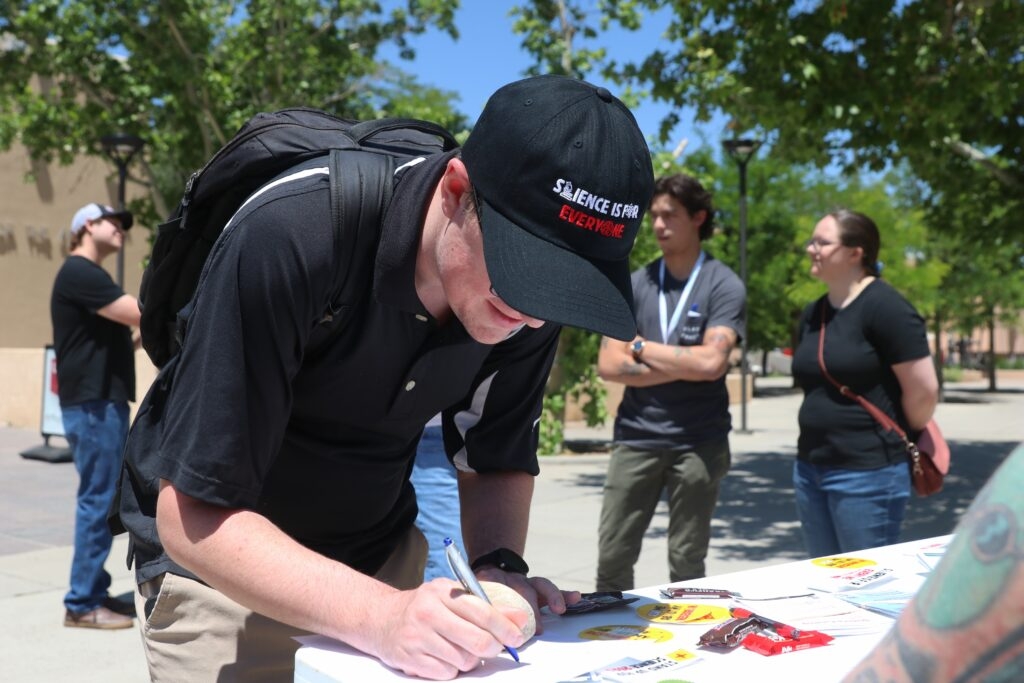 UNM post-docs forewarn threats to research at Stand Up for Science event