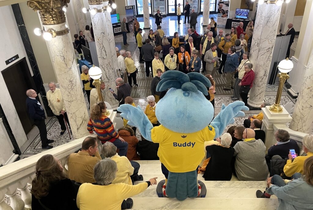 Busloads of public broadcasting supporters make case to avoid $3.6 million state budget cut