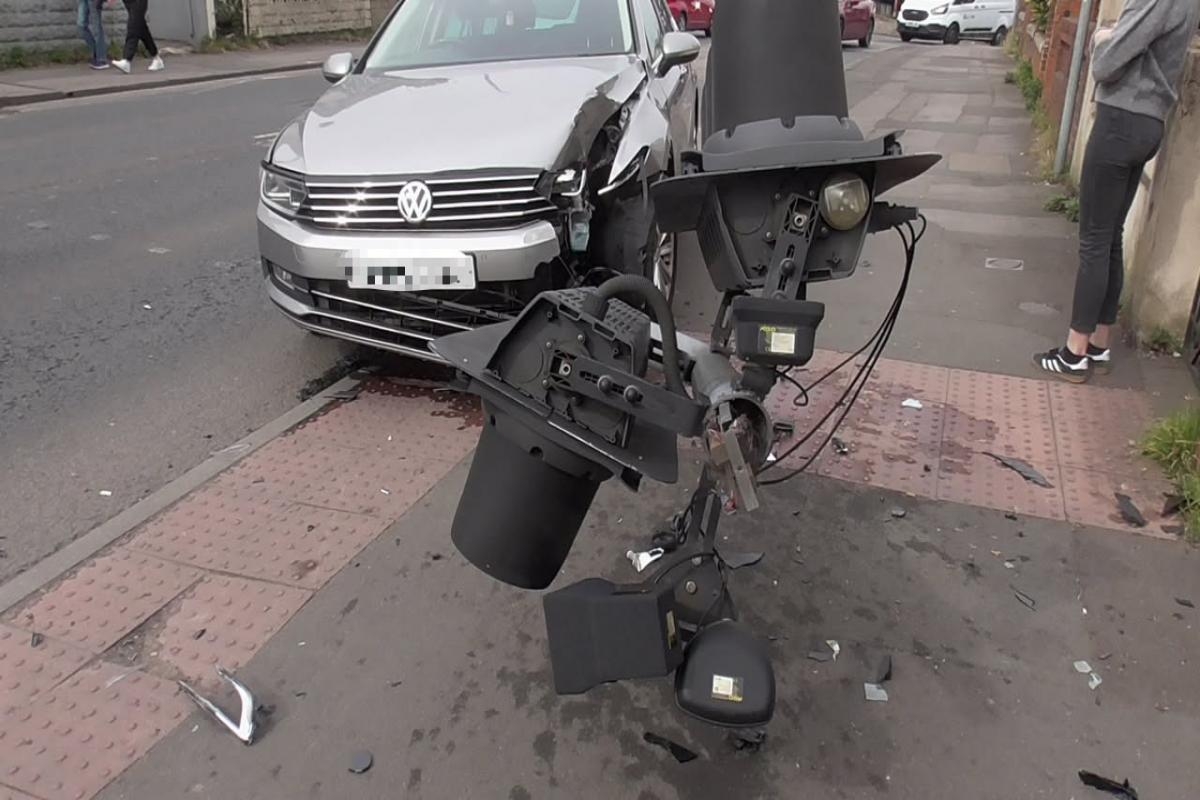 Traffic light smashed in crash near busy roundabout