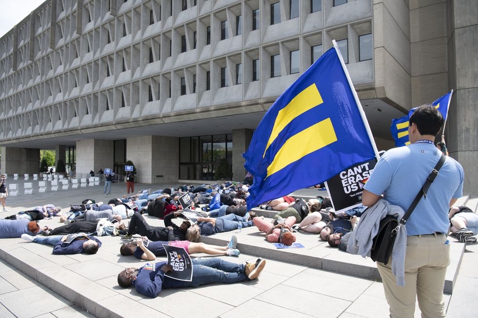 Activists hold 'die-in' at HHS to protest Trump health care cuts: in photos