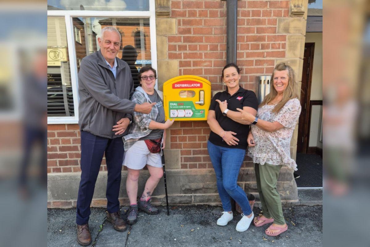 Pub regulars proudly fund potentially life-saving kit outside their local