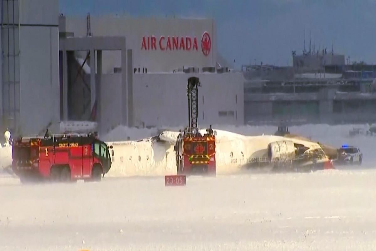 Eight hurt as plane overturns on landing at Toronto airport