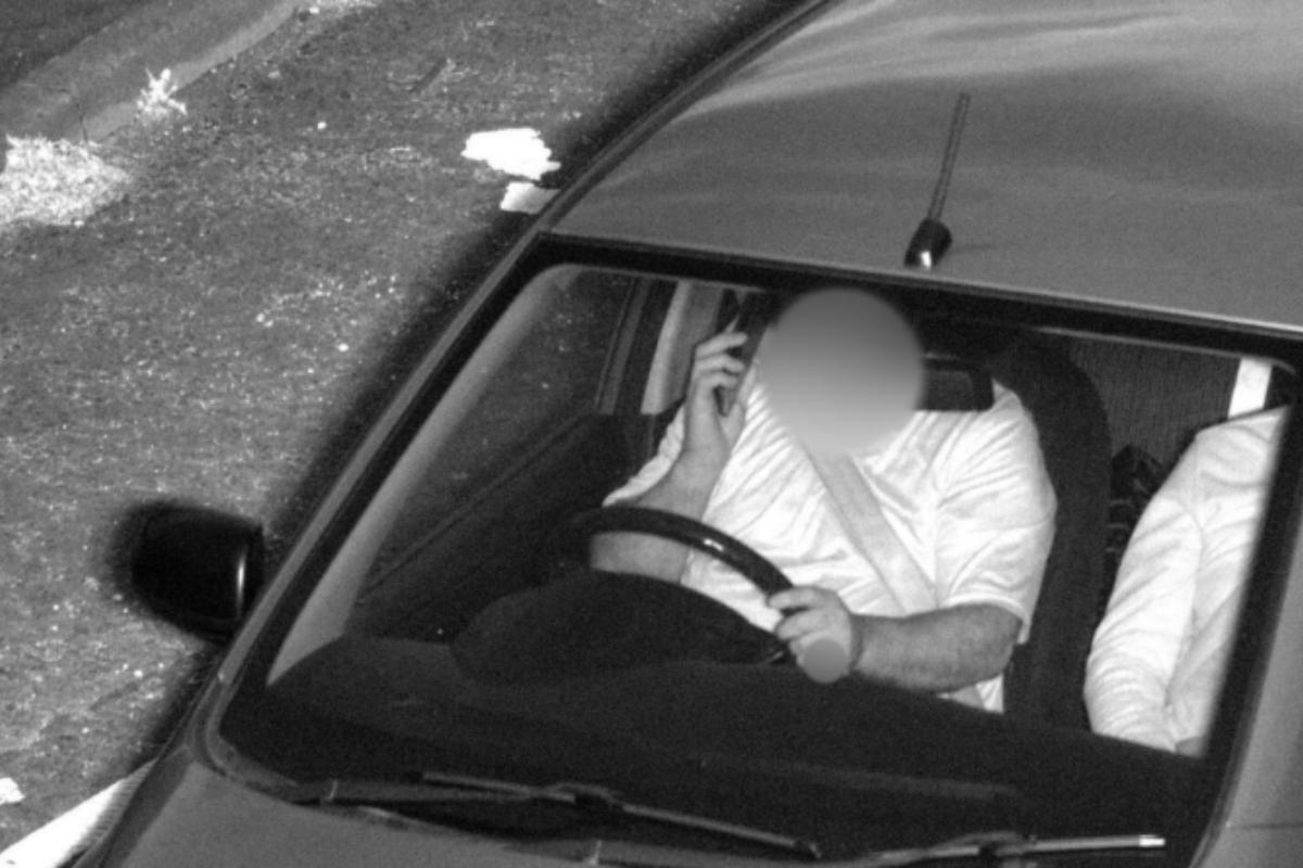 Police take photos of distracted drivers from top deck of bus