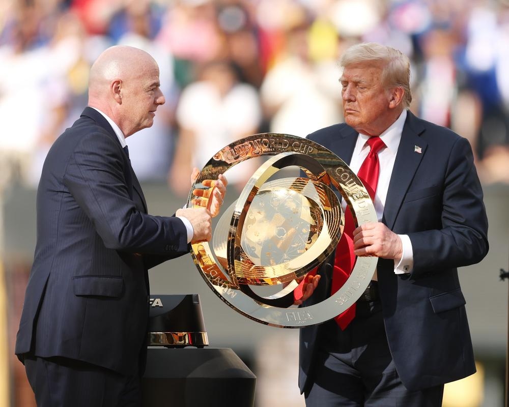 Trump booed but unbowed at Club World Cup final as he crashes Chelsea's trophy lift