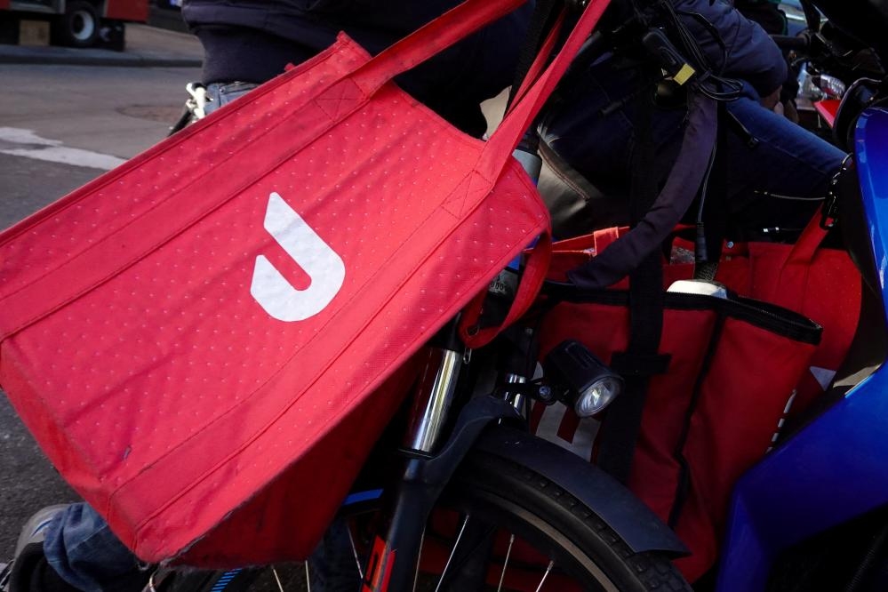 New York official charged in shooting of DoorDash delivery driver who was lost