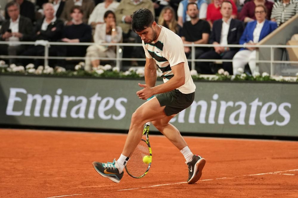 Carlos Alcaraz battles past Lorenzo Musetti to reach French Open final