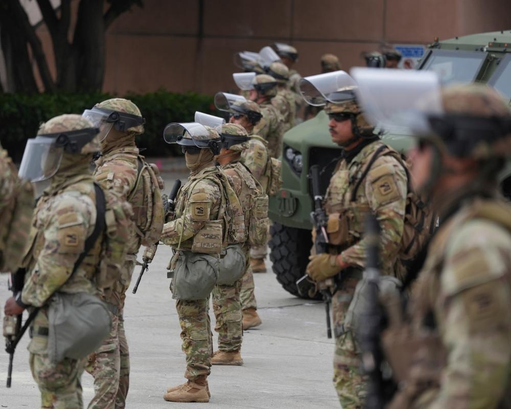 National guard deploys in downtown LA amid eerie calm after two days of unrest