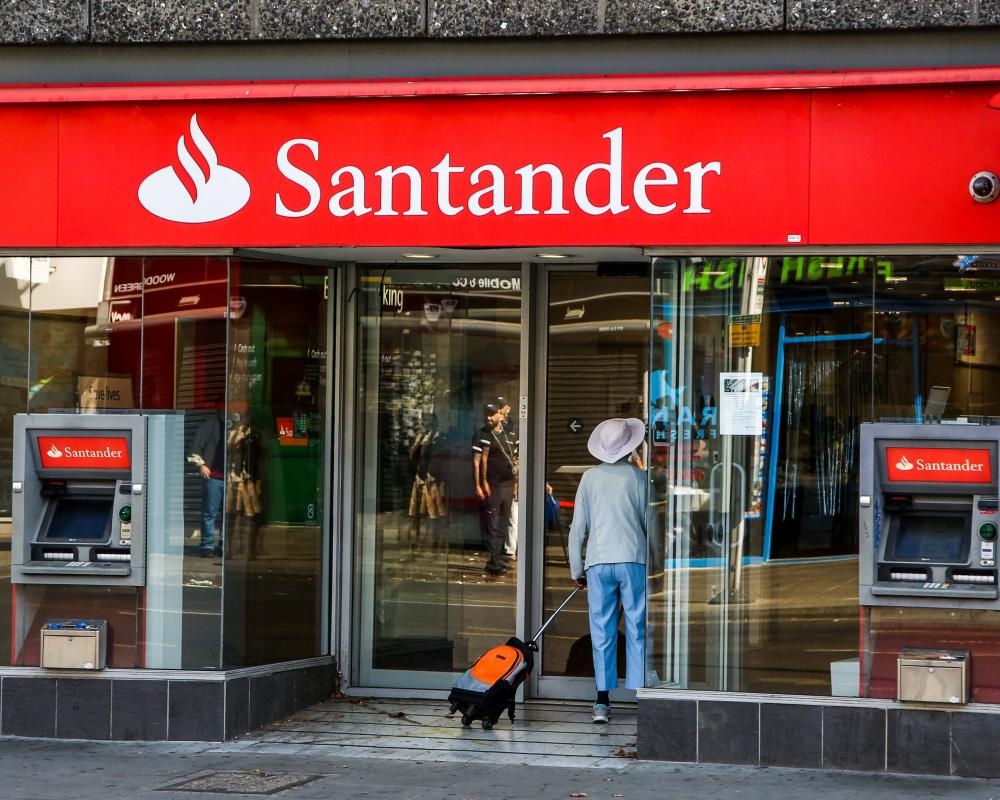 Santander UK freezes salaries and cuts jobs in commercial banking arm