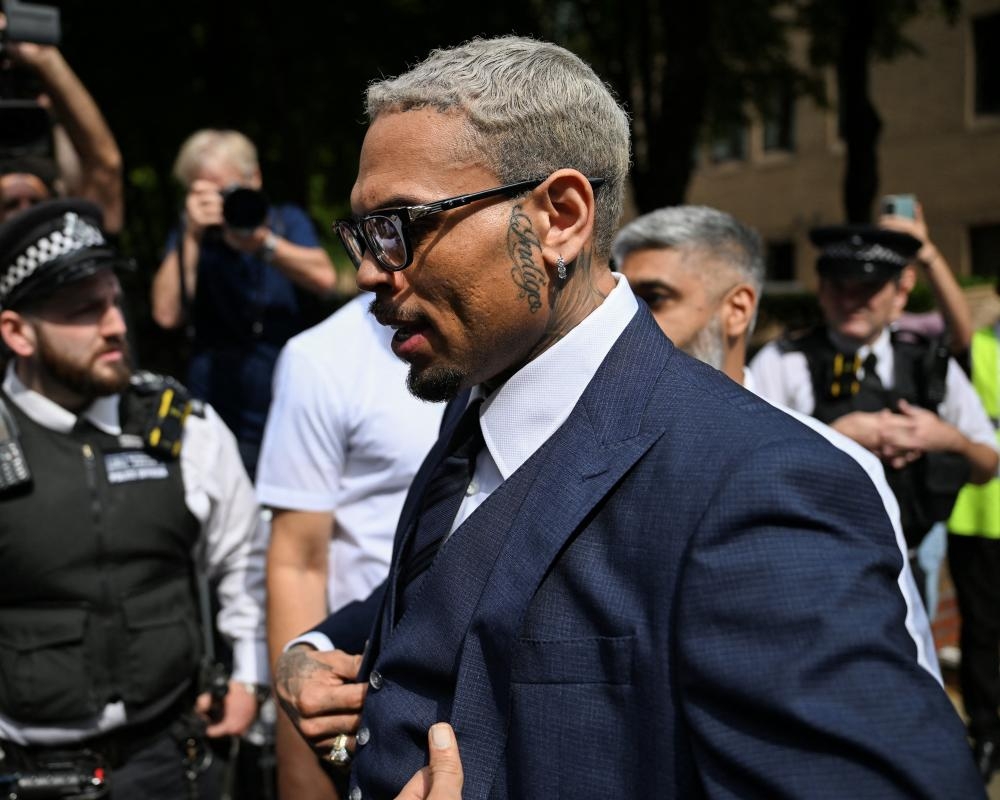 Chris Brown enters not guilty plea over alleged bottle attack at London club