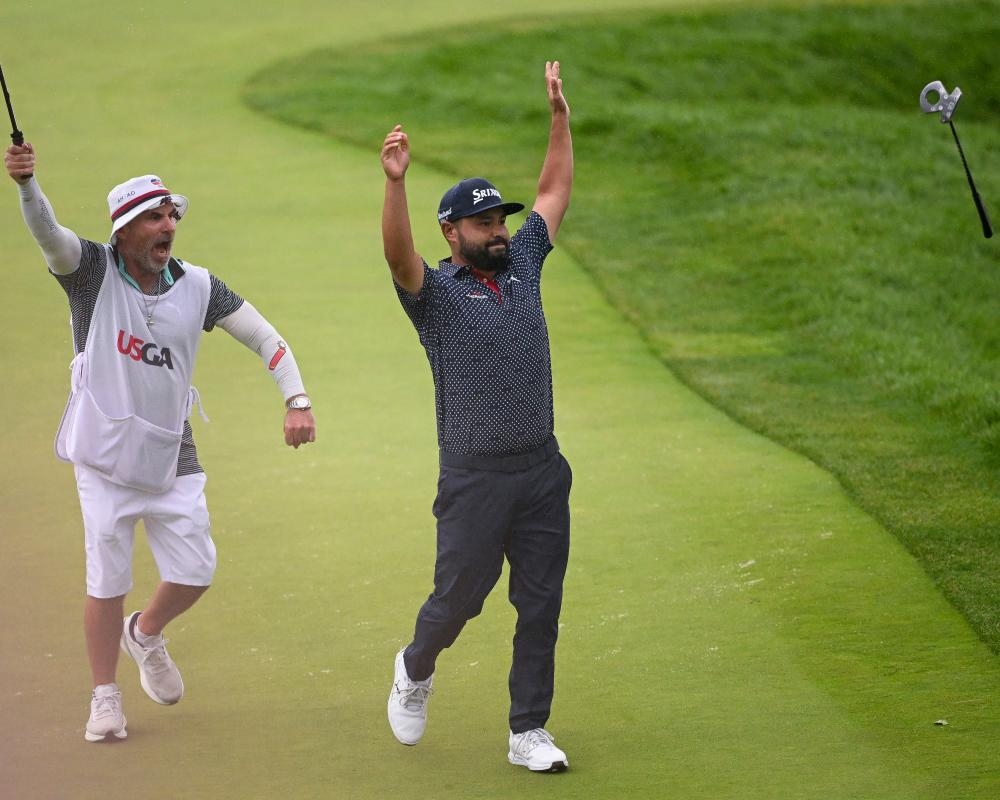 JJ Spaun completes fairytale with monster final putt on wet and wild day at US Open