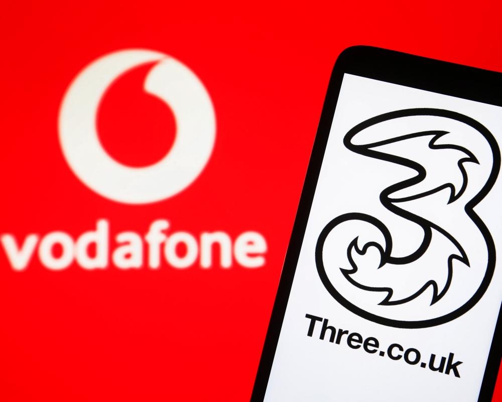 Vodafone vows to invest more than £1bn in a year as it seals Three UK merger