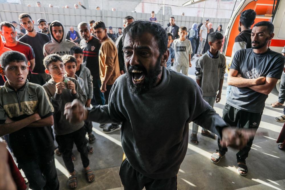Palestinians gunned down while trying to reach food aid site in Gaza, hospital says