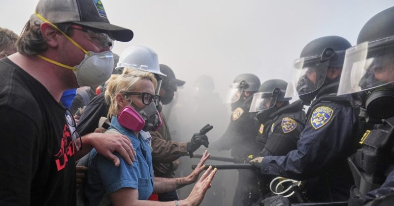 Man handcuffed for allegedly giving out face shields to ‘suspected rioters' at LA protest