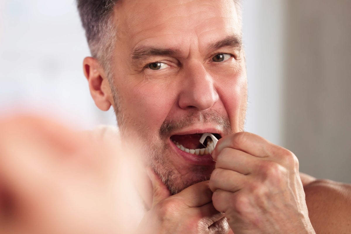 Researchers think this dental floss could track cancer and tell if you're stressed. Here's how