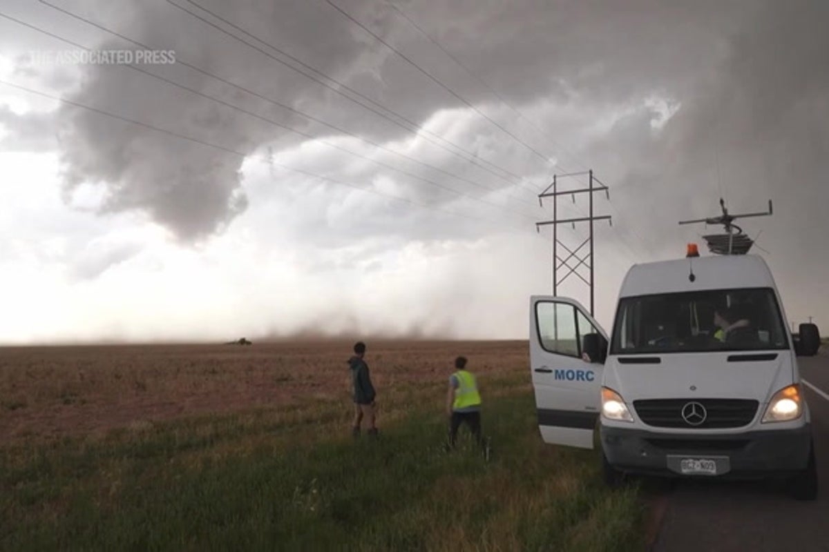 Watch as storm chasers drive into the heart of a huge hailstorm