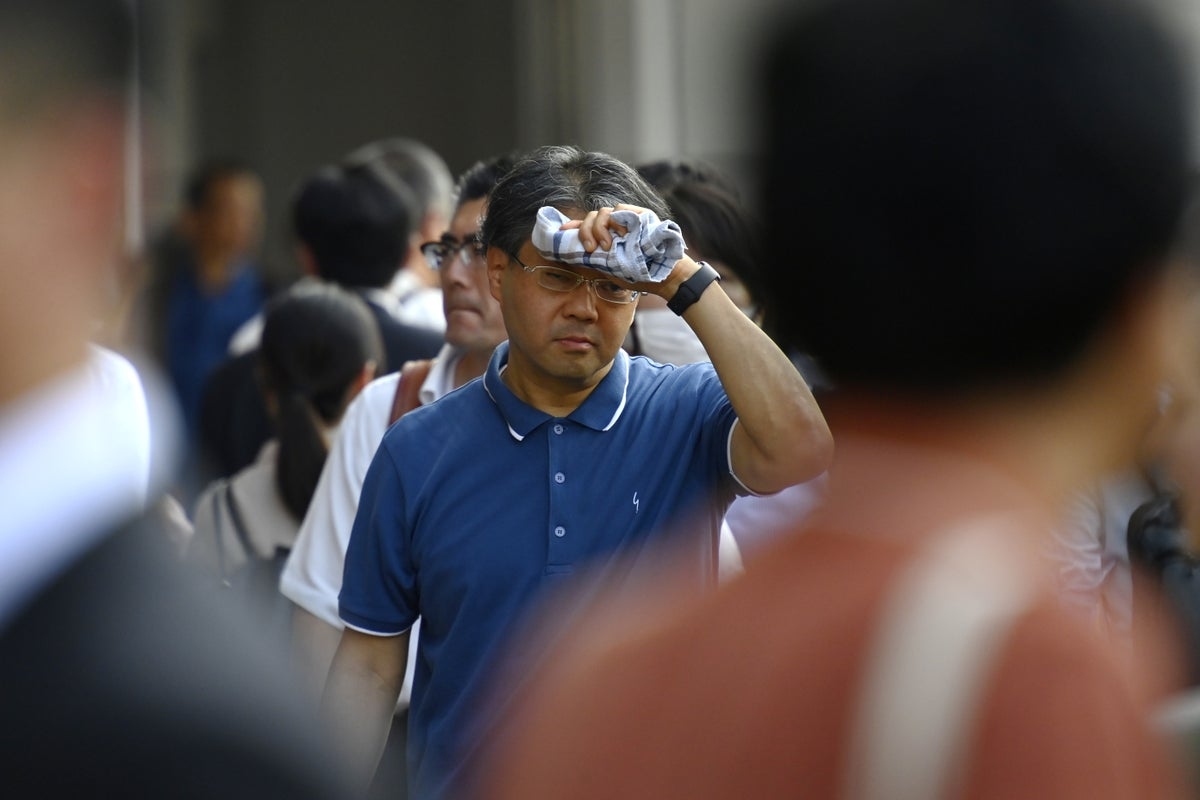 Japan on alert after four people die amid early summer heatwave
