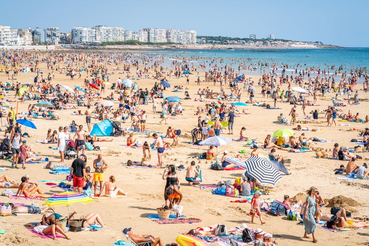 ‘A little decorum, please!': Shirtless tourists face hefty fine in French holiday hotspot