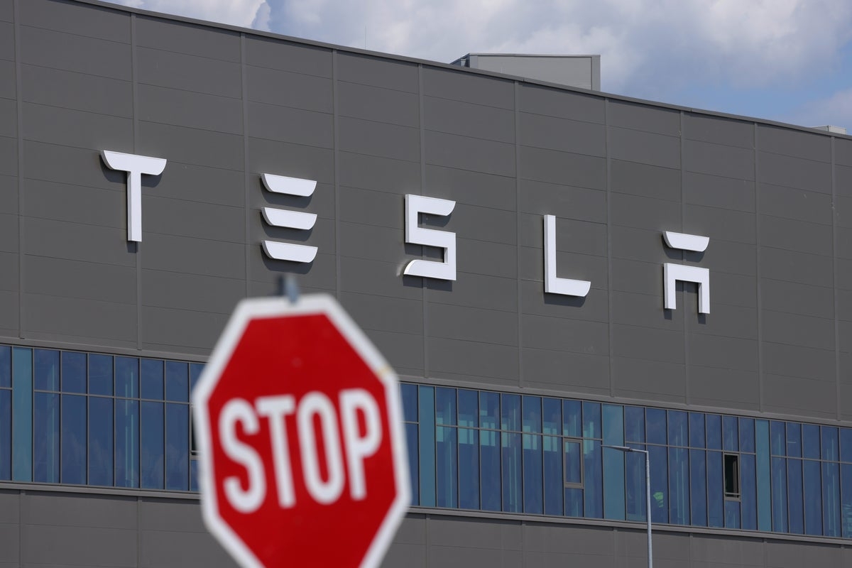 Widow of designer who died in fiery Tesla crash sues automaker claiming car had ‘defective design'