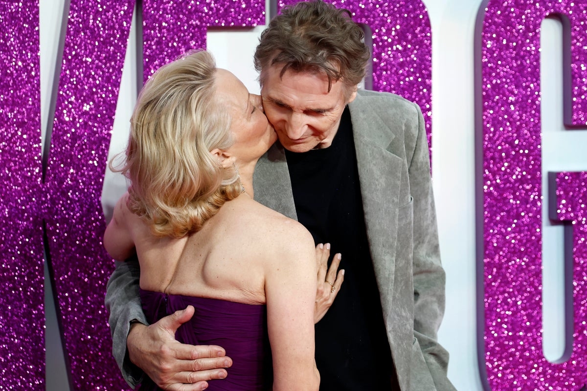Pamela Anderson and Liam Neeson share red carpet kiss after his stunning confession about her