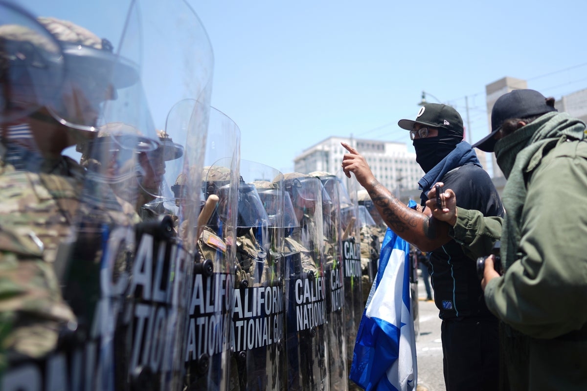 Trump orders law enforcement to ‘liberate' LA from ‘migrant invasion' amid clashes over ICE raids