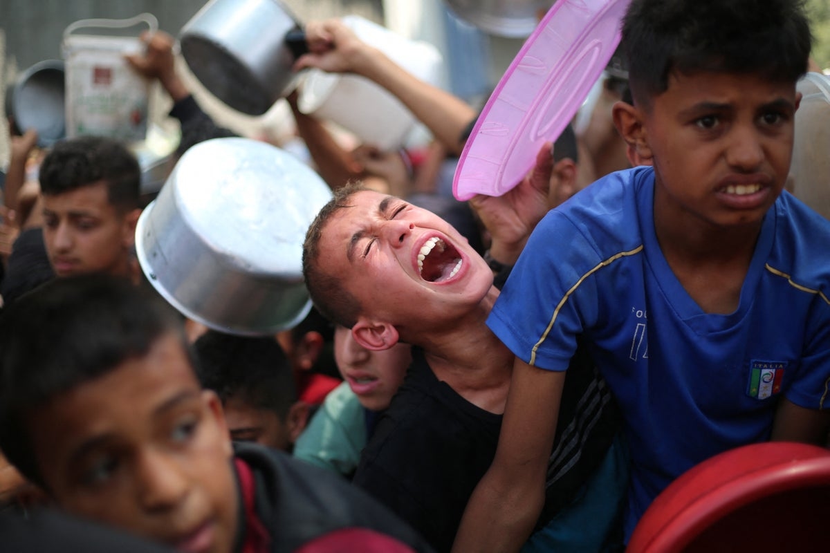 ‘My son went to get flour. He came back in a coffin': As the world focuses on Iran, Palestinians are being shot dead seeking aid