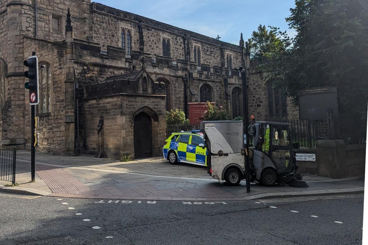 Two men taken to hospital after 'medical episode' in churchyard as cordon in place