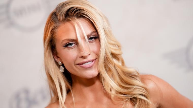 ‘SI' Swim model risks braless handkerchief top for windy helicopter ride