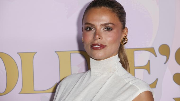 7-time ‘SI' Swim model risks barely-there gown with braless sister