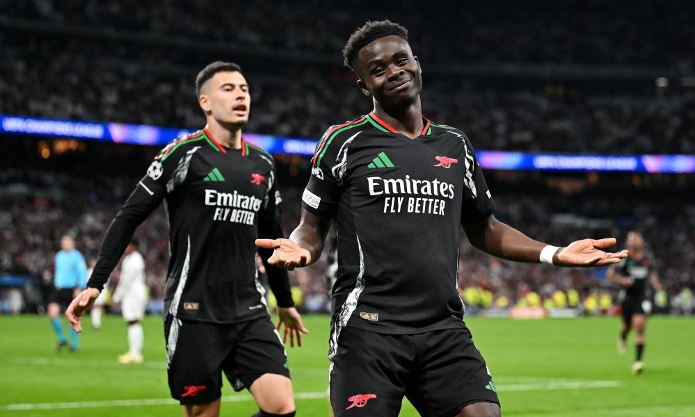 Saka and Martinelli fire Arsenal to last four after famous win at Real Madrid