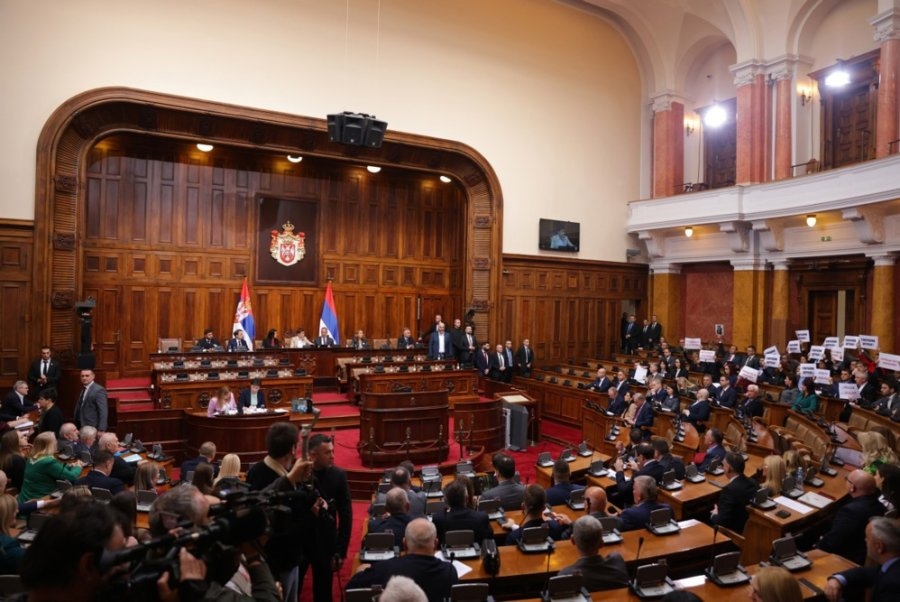 Serbia's parliament erupts in chaos after opposition lawmakers hurl smoke, fire bombs
