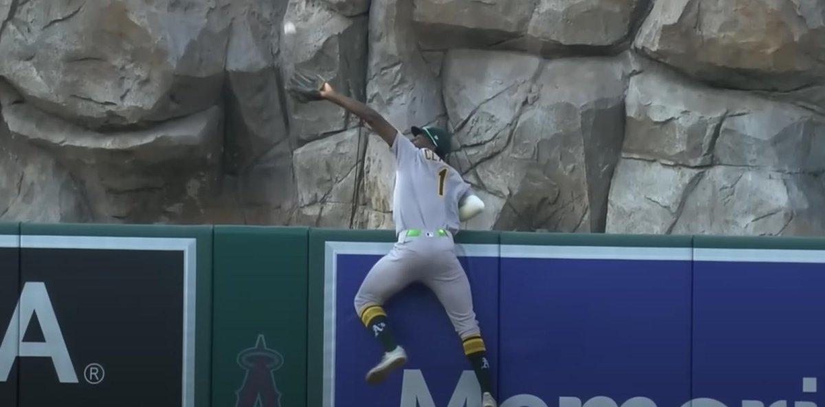 Watch: Athletics' Denzel Clarke nearly jumps over wall with home run robbery