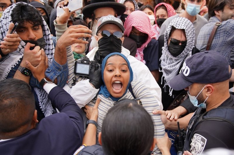 2 Columbia safety officers hurt as scores of pro-Palestinian protesters force way into library